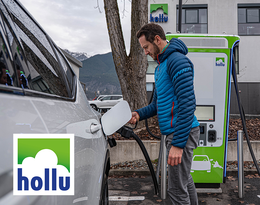 Mann lädt ein Elektroauto. Logo Hollu Systemhygiene GmbH 